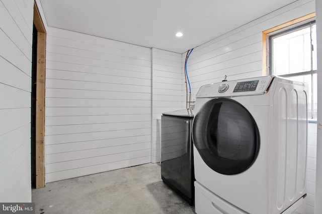 laundry area featuring separate washer and dryer, laundry area, and recessed lighting