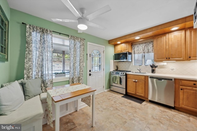 6 Birkshire Rd, Hamilton, NJ 08619 - kitchen with backsplash, stainless steel appliances, light countertops, and a sink