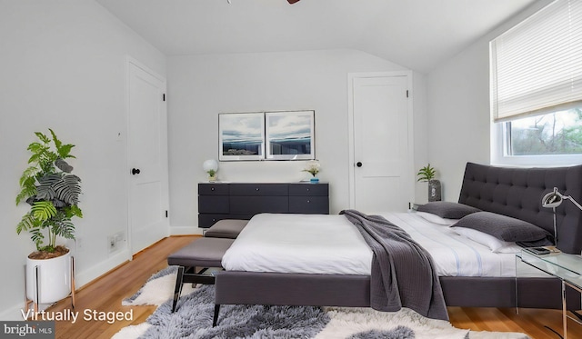 5011 37th Ave, Hyattsville, MD 20782 - bedroom with baseboards, wood finished floors, and lofted ceiling