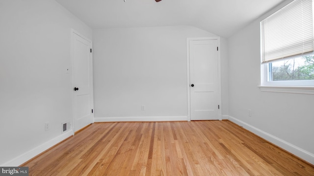 5011 37th Ave, Hyattsville, MD 20782 - unfurnished room with light wood finished floors, baseboards, a ceiling fan, and lofted ceiling