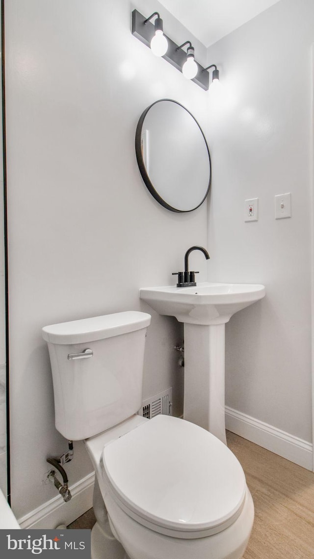 5011 37th Ave, Hyattsville, MD 20782 - bathroom with visible vents, toilet, wood finished floors, and baseboards