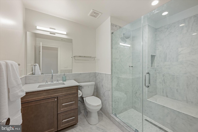 1335 11th St NW Unit 204, Washington, DC 20001 - full bathroom featuring vanity, tile walls, toilet, a stall shower, and visible vents