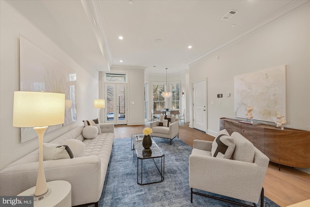 1335 11th St NW Unit 204, Washington, DC 20001 - living room with crown molding, wood finished floors, baseboards, visible vents, and recessed lighting