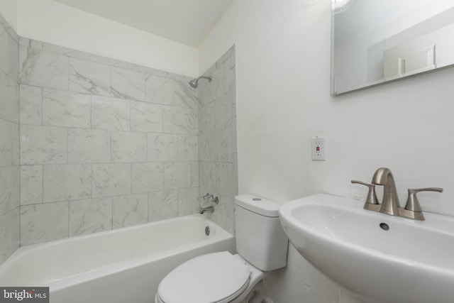 full bathroom featuring a sink, toilet, and washtub / shower combination