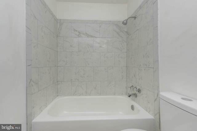 bathroom featuring toilet and washtub / shower combination