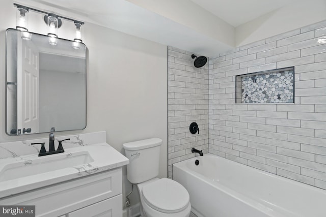 bathroom featuring toilet, tub / shower combination, and vanity