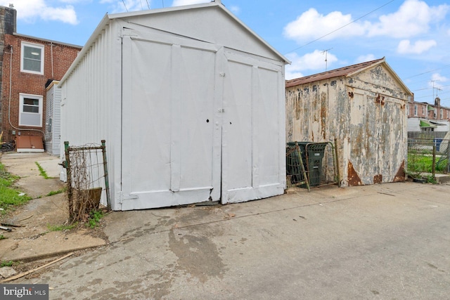 view of shed with fence