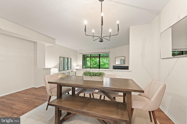 11116 Boathouse Ct Unit 93, Reston, VA 20191 - dining room with a chandelier, wood finished floors, and baseboards