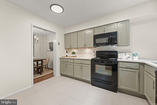 11116 Boathouse Ct Unit 93, Reston, VA 20191 - kitchen with black appliances, gray cabinets, and light countertops