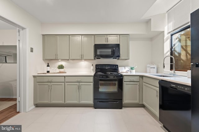 11116 Boathouse Ct Unit 93, Reston, VA 20191 - kitchen featuring black appliances, a sink, light countertops, and gray cabinetry