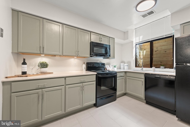 11116 Boathouse Ct Unit 93, Reston, VA 20191 - kitchen with black appliances, gray cabinets, and a sink
