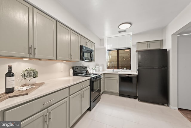 11116 Boathouse Ct Unit 93, Reston, VA 20191 - kitchen with black appliances, gray cabinets, and a sink