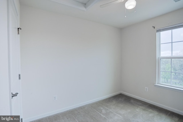 unfurnished room with baseboards, ceiling fan, and carpet