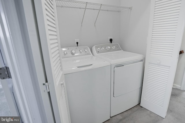 laundry room featuring washer and dryer and laundry area