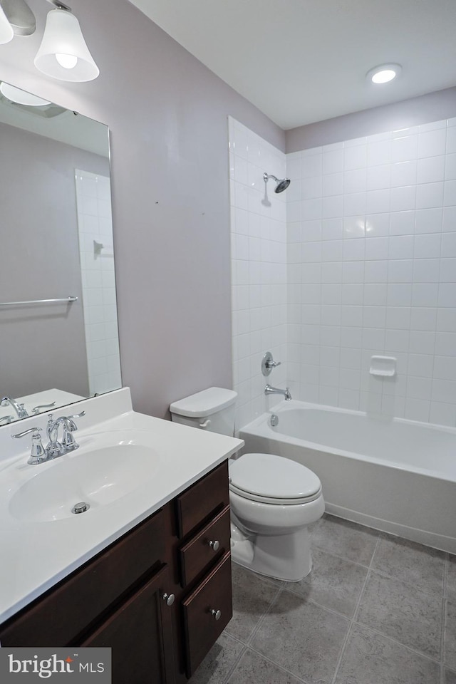 bathroom with toilet, vanity, and bathing tub / shower combination