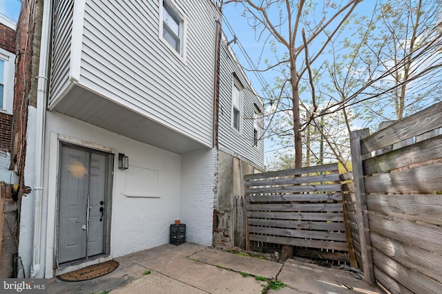 1652 S Ringgold St, Philadelphia, PA 19145 - view of side of property with fence and brick siding
