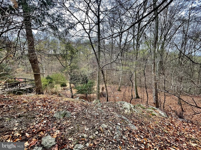 view of landscape with a view of trees
