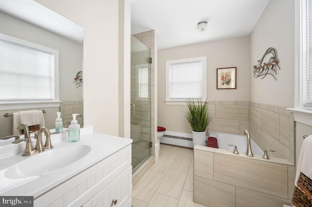 full bath with vanity, a stall shower, a healthy amount of sunlight, and a baseboard heating unit