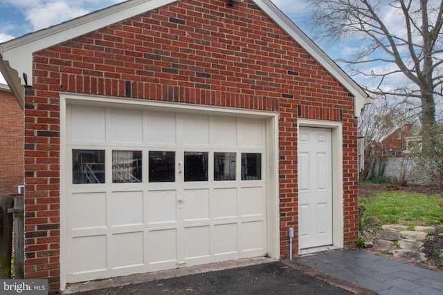garage featuring driveway