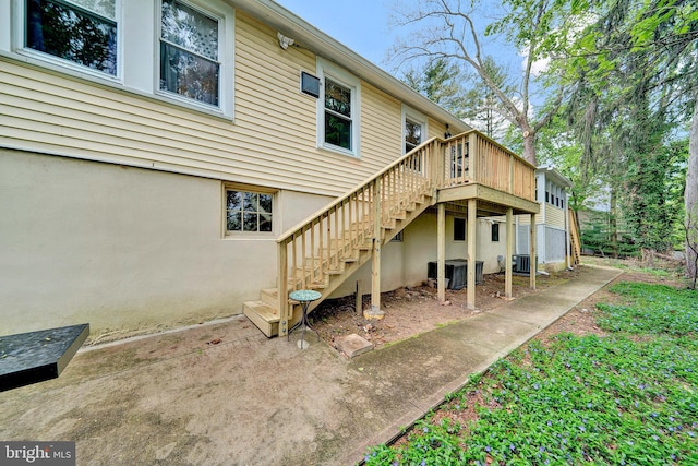 24 Montague Ave, Ewing, NJ 08628 - back of property featuring stairs, central AC, and a wooden deck