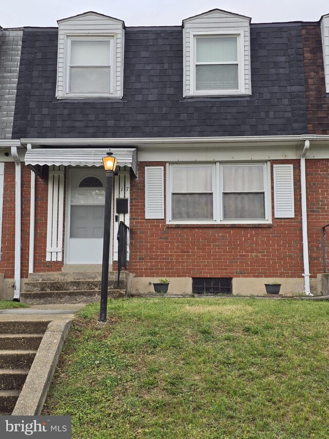 17 Haley Rd, Baltimore, MD 21221 - view of front of house with brick siding, a front lawn, roof with shingles, and entry steps
