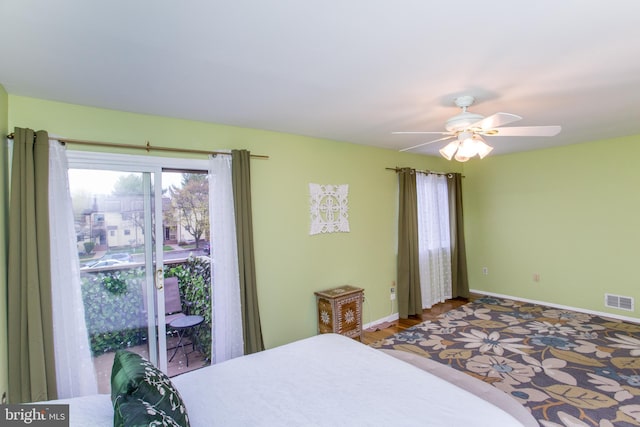 bedroom featuring visible vents, access to outside, baseboards, and a ceiling fan