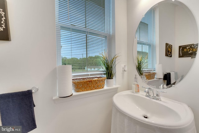 bathroom with a sink and plenty of natural light