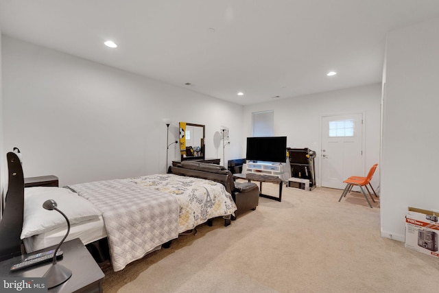 bedroom with light colored carpet and recessed lighting