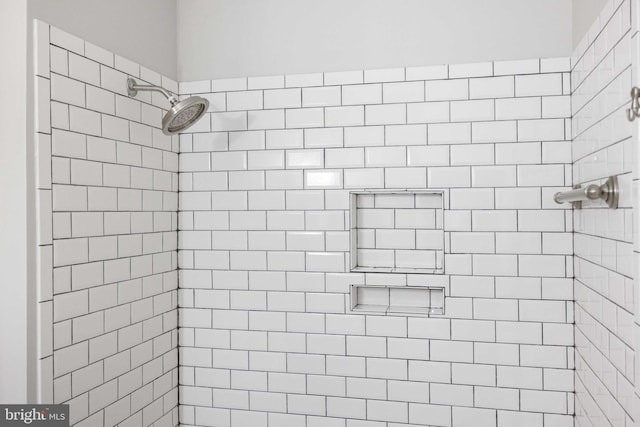 bathroom with a tile shower