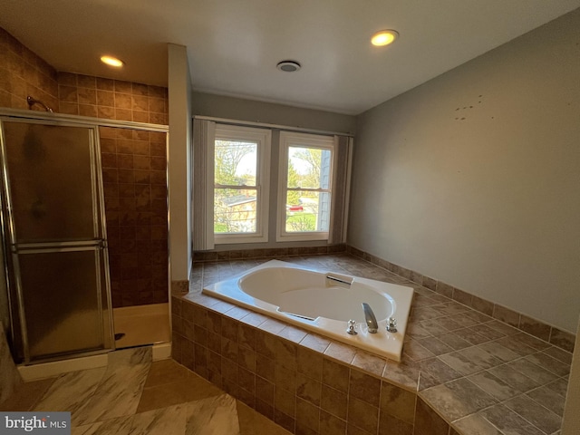 full bathroom with a stall shower, recessed lighting, and a garden tub