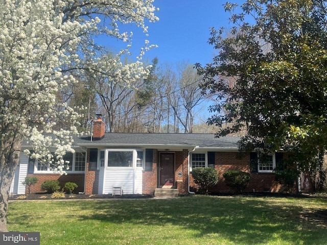 9532 Sherwood Dr, Upper Marlboro, MD 20772 - ranch-style home with a chimney, a front lawn, and brick siding