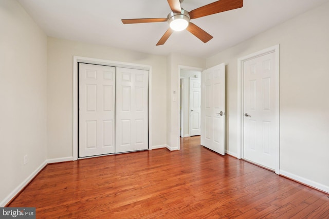 9532 Sherwood Dr, Upper Marlboro, MD 20772 - unfurnished bedroom with a ceiling fan, baseboards, wood finished floors, and a closet