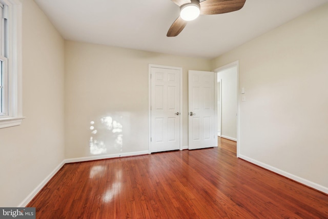 9532 Sherwood Dr, Upper Marlboro, MD 20772 - unfurnished bedroom featuring baseboards, a ceiling fan, and wood finished floors