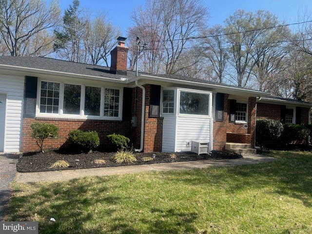 9532 Sherwood Dr, Upper Marlboro, MD 20772 - ranch-style home with brick siding, a chimney, and a front yard
