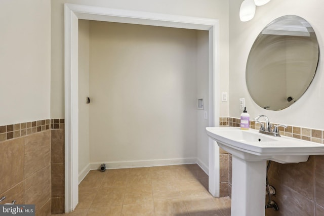 9532 Sherwood Dr, Upper Marlboro, MD 20772 - bathroom featuring tile patterned floors, tile walls, and a sink