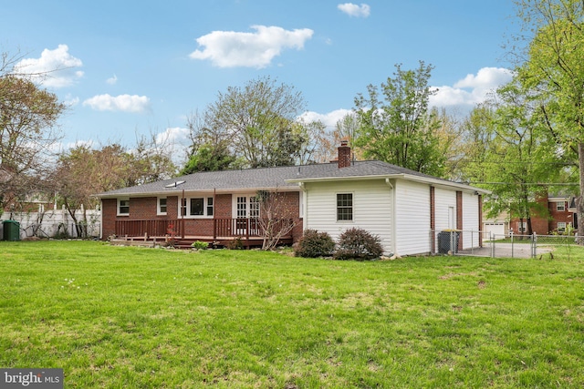 9532 Sherwood Dr, Upper Marlboro, MD 20772 - rear view of house with a lawn, a deck, fence, and a chimney