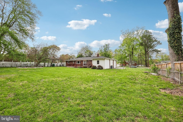 9532 Sherwood Dr, Upper Marlboro, MD 20772 - view of yard featuring a fenced backyard and a wooden deck