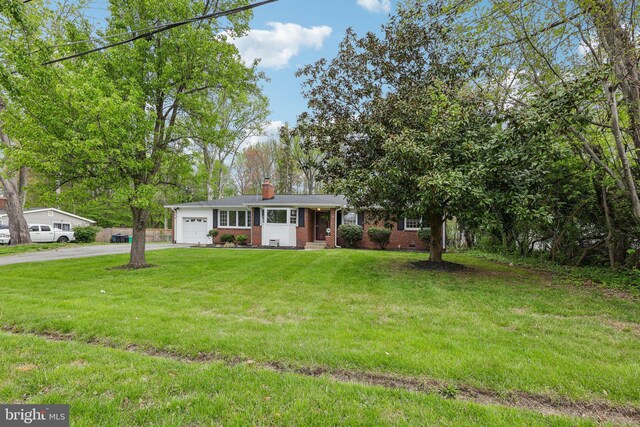 9532 Sherwood Dr, Upper Marlboro, MD 20772 - ranch-style home featuring a chimney, a front yard, brick siding, aphalt driveway, and an attached garage