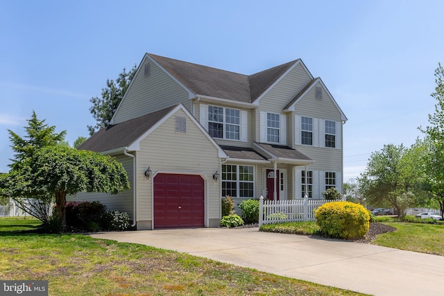view of front of home with fence and driveway