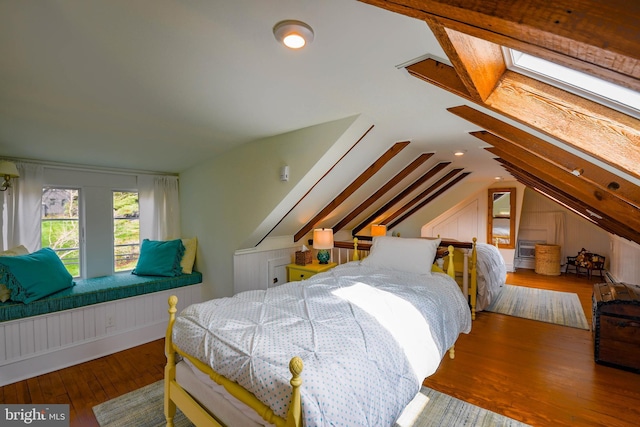 bedroom with lofted ceiling and hardwood / wood-style floors