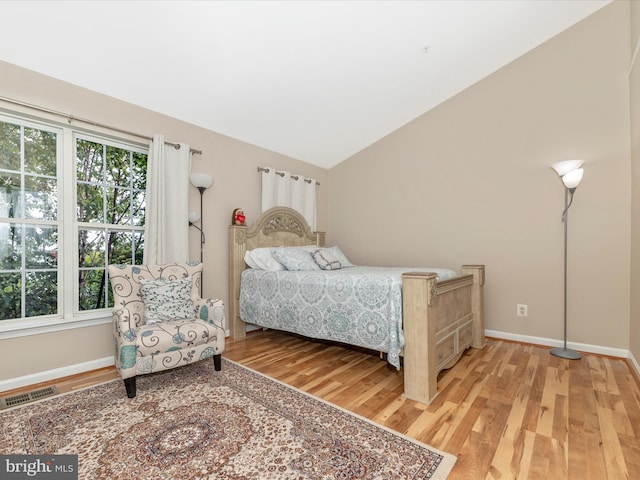 353 Fallsgrove Dr Unit 51, Rockville, MD 20850 - bedroom with baseboards, lofted ceiling, light wood-style flooring, and visible vents