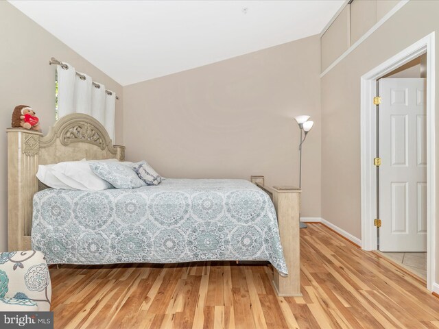 353 Fallsgrove Dr Unit 51, Rockville, MD 20850 - bedroom with baseboards and light wood-style flooring