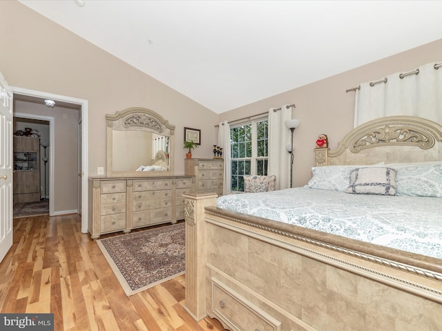353 Fallsgrove Dr Unit 51, Rockville, MD 20850 - bedroom featuring vaulted ceiling and light wood-style floors