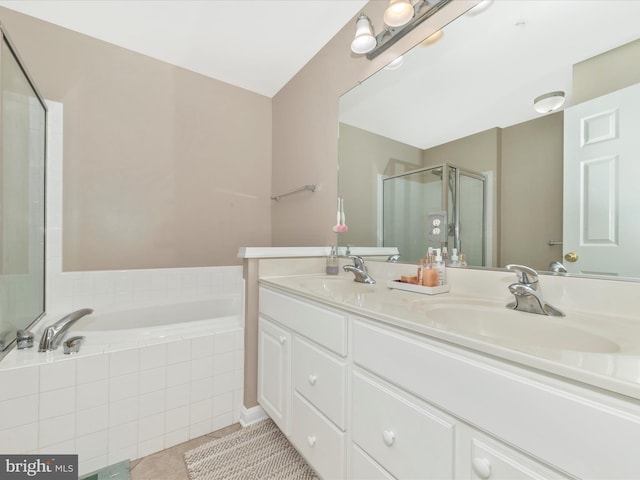 353 Fallsgrove Dr Unit 51, Rockville, MD 20850 - bathroom with double vanity, a sink, a stall shower, and a garden tub