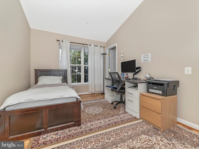 353 Fallsgrove Dr Unit 51, Rockville, MD 20850 - bedroom featuring baseboards, light wood-style flooring, and vaulted ceiling
