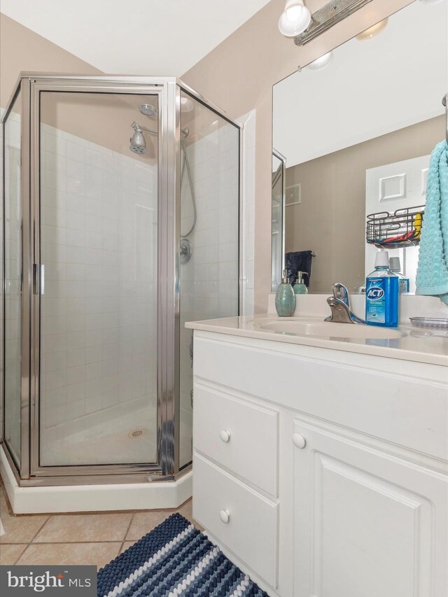 353 Fallsgrove Dr Unit 51, Rockville, MD 20850 - bathroom with a stall shower, tile patterned floors, and vanity