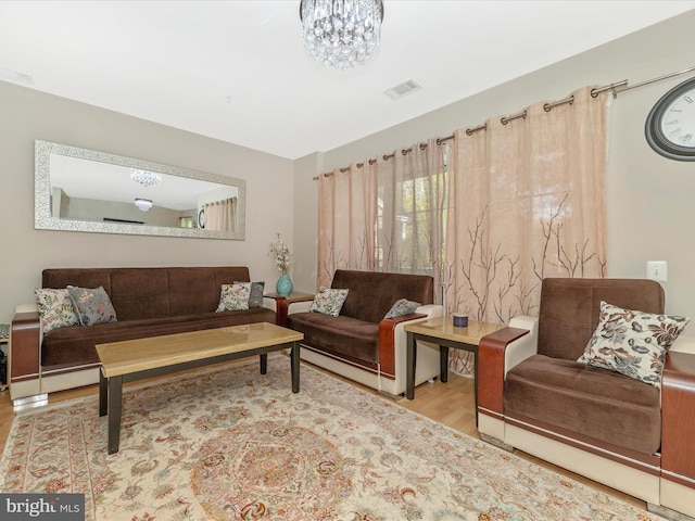 353 Fallsgrove Dr Unit 51, Rockville, MD 20850 - living room with visible vents, a notable chandelier, and wood finished floors