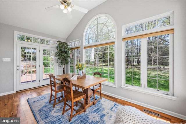 sunroom featuring french doors, plenty of natural light, and visible vents