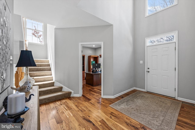 entrance foyer featuring wood finished floors and plenty of natural light