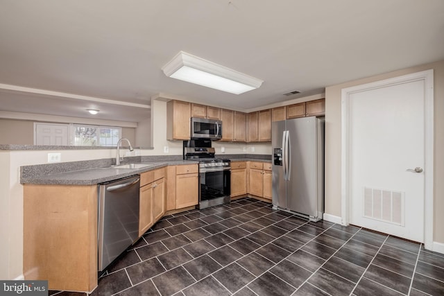 1465 N Van Dorn St, Alexandria, VA 22304 - kitchen featuring light brown cabinetry, stainless steel appliances, a sink, visible vents, and a peninsula